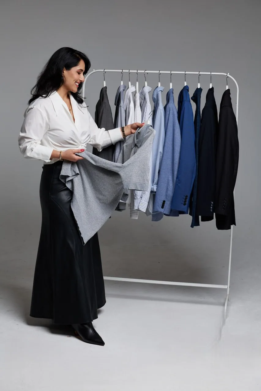 Mina Azarian editing a client wardrobe at the rack in Perth